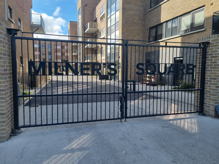steel gate apartment building sign